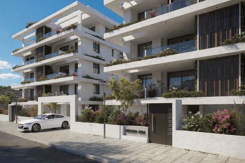 Modern apartment building with balconies and landscaped greenery in Paralimni, Cyprus
