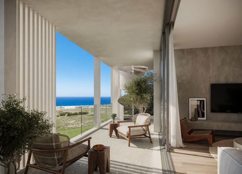 Private balcony with seating and spiral staircase overlooking the Mediterranean Sea in Cyprus