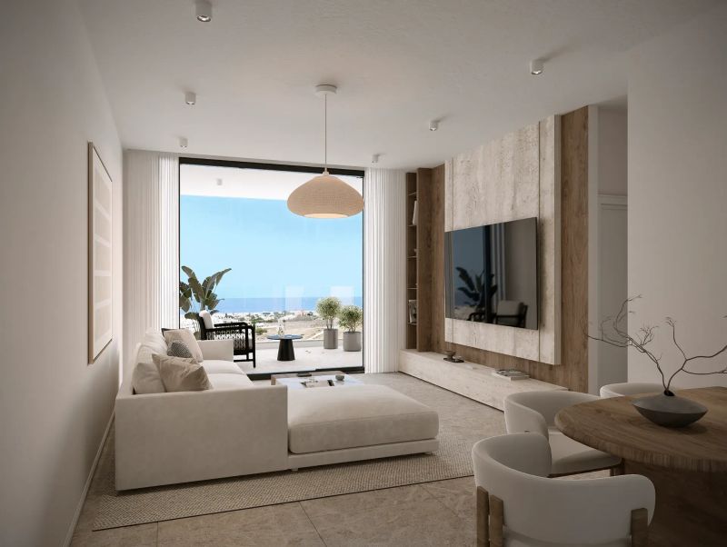 Bright modern living room with large window overlooking the Mediterranean sea