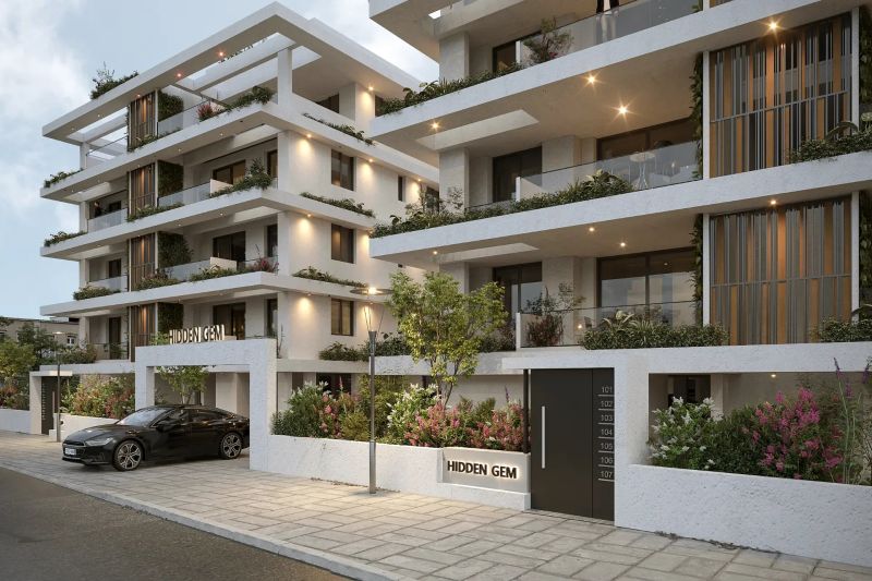 Contemporary apartment building exterior with balconies and planted greenery